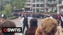 Huge crowds gathered in London surge past police in attempt to get glimpse of Queen's funeral procession