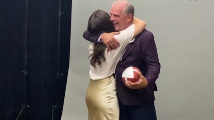Daughter surprises dad by appearing alongside him in his football Hall of Fame photoshoot