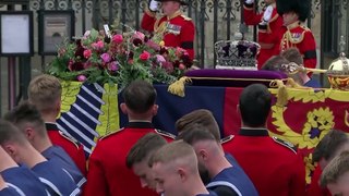 The Queen's pallbearers carry her coffin to Westminster Abbey