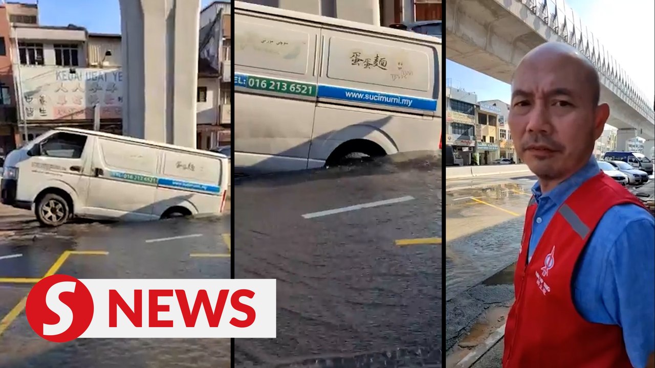 Van trapped in sinkhole during rush hour on Jalan Kepong