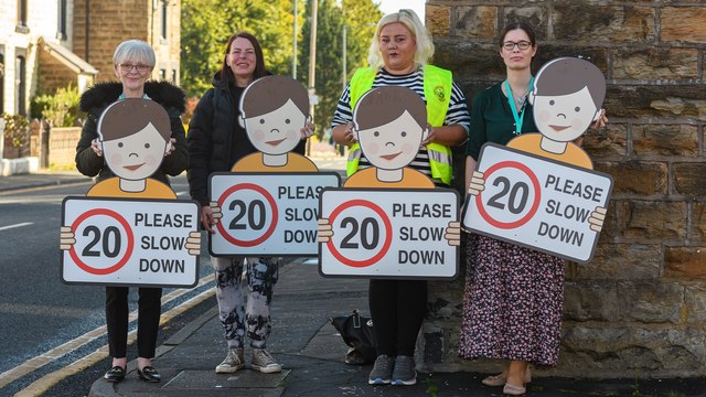 Road signs promoting safe driving place on Gannow Lane, Burnley