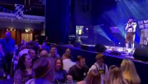 Bavarian oompah band leads Oktoberfest 2022 punters in a sing-song