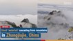 Cloud "waterfall" cascading from mountains in Zhangjiajie, China | The Nation