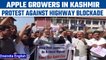 Kashmir apple growers protest against highway blockade, demand early opening | Oneindia News *News