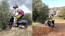 Moto enthusiast performs extreme stunts on a Vespa