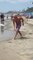 Man Plays and Shows Balancing Tricks With Frisbee on Beach