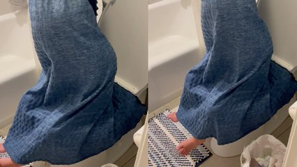 Woman finds her daughter hiding behind shower curtain while sitting on toilet seat