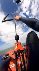 Pro Kiteboarder Flips While Grabbing His Board During Kitesurfing Session