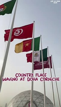 Flags of Fifa World Cup Qatar 2022 qualified nations waving at Doha Corniche