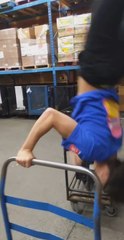 Guy Falls While Attempting to Perform Stunt Between Two Shopping Carts
