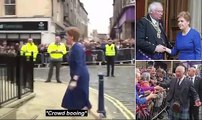 Nicola Sturgeon's frosty reception: Scotland's First Minister is booed and whistled by crowd as she arrives in Dunfermline for city-making ceremony - while King Charles is greeted by fans waving Union flags