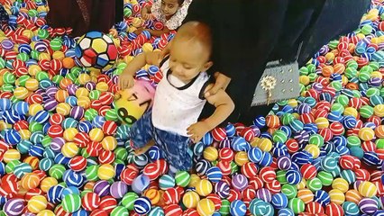 Cute Baby Playing Indoor Playground With Ball Pit