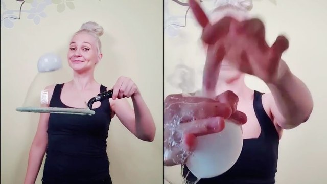 Jaw-dropping footage of woman flawlessly bouncing smoke bubble on soap bubble