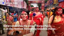 Large idols of Goddess Durga immersed in Ganges at end of Indian festival