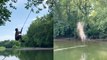 Guy gets whipped by rope while swinging over lake