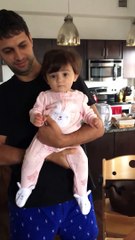 Dancing baby girl adorably does the twist