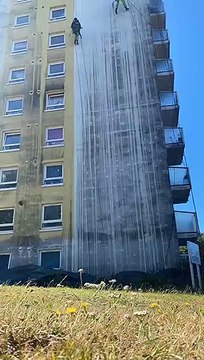 Four Courts in St Leonards gets a makeover by abseilers