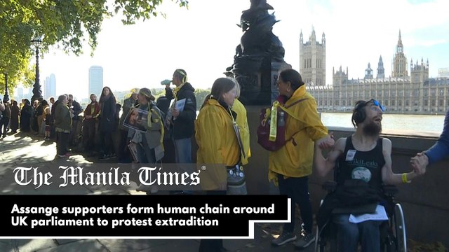 Assange supporters form human chain around UK parliament to protest extradition