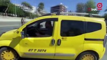 Ceza yazılacağını öğrenen ticari taksi sürücüsü aracının üzerine çıktı