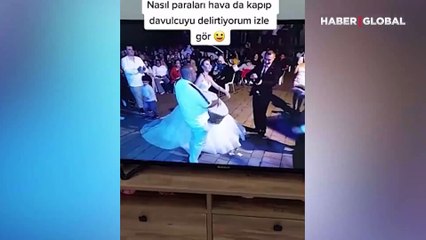 Havaya saçılan paraları toplayan gelin davulcuyu kızdırdı