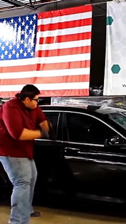 Boy tries to break the bulletproof  car mirror