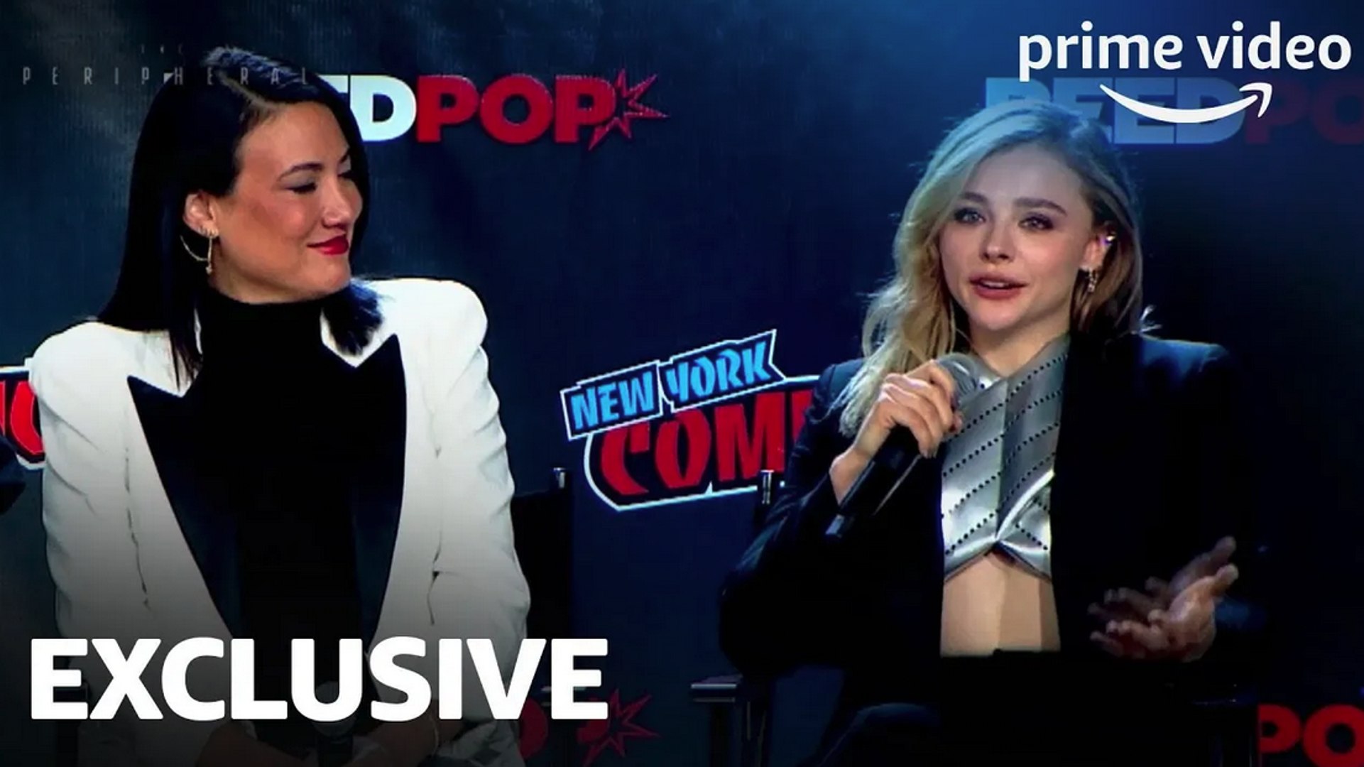 Chloe Grace Moretz flashes a wide smile while promoting her upcoming series  The Peripheral at NYCC