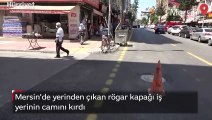 Mersin'de yerinden çıkan rögar kapağı iş yerinin camını kırdı