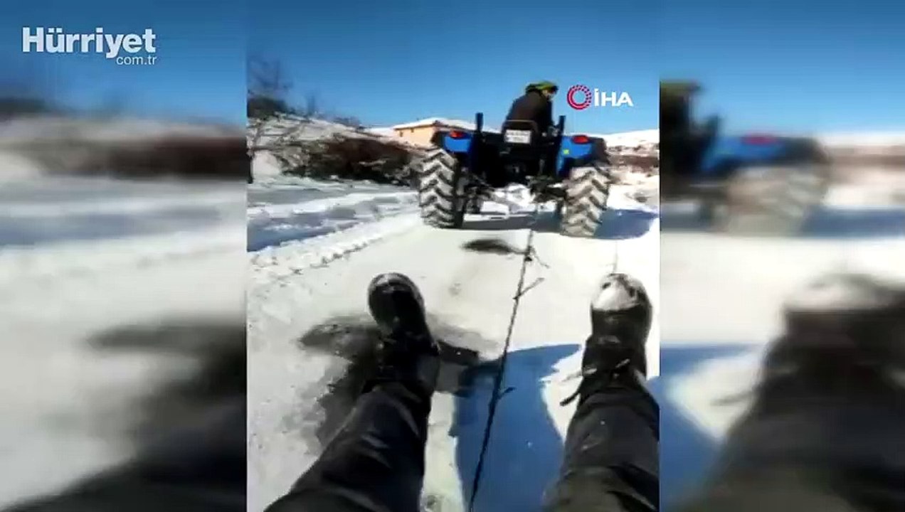 Malatya’da traktör arkasında karda sörf