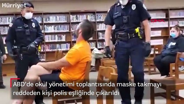 ABD'de okul yönetimi toplantısında maske takmayı reddeden kişi polis eşliğinde çıkarıldı