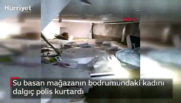 Su basan mağazanın bodrumundaki kadını dalgıç polis kurtardı