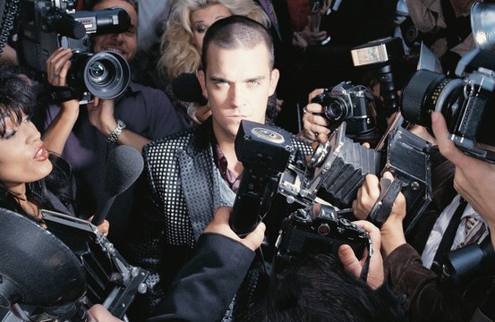 Robbie Williams releasing a 25th anniversary deluxe version of debut solo LP Life thru a Lens