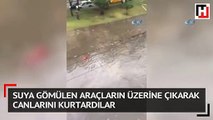 Suya gömülen araçların üzerine çıkarak canlarını kurtardılar
