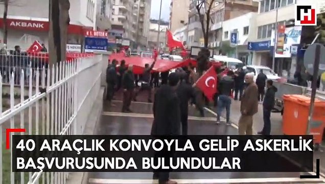 40 araçlık konvoyla gelip askerlik şubesine başvurdular
