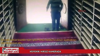 Camiden ayakkabıları koklayarak çalan hırsız kamerada