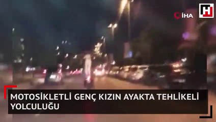 Motosikletli genç kızın ayakta tehlikeli yolculuğu