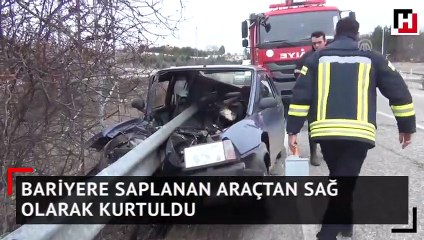 Bariyere saplanan araçtan sağ olarak kurtuldu