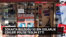 Sokakta bulduğu 50 bin dolarlık çekleri polise teslim etti
