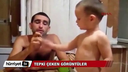 Çocuğuna sigara içiren babaya büyük tepki