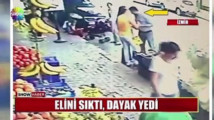 Elini sıktı, dayak yedi