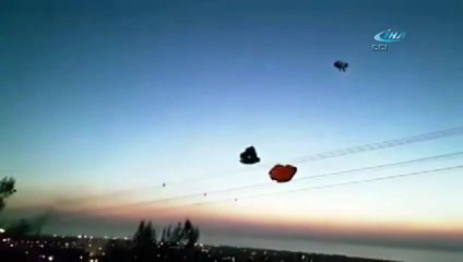 Paraşütçü helikopterin rüzgarıyla yere çakıldı