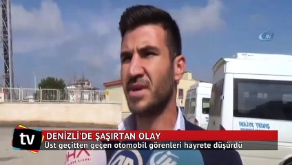 Üst geçitten geçen otomobil görenleri şaşırttı