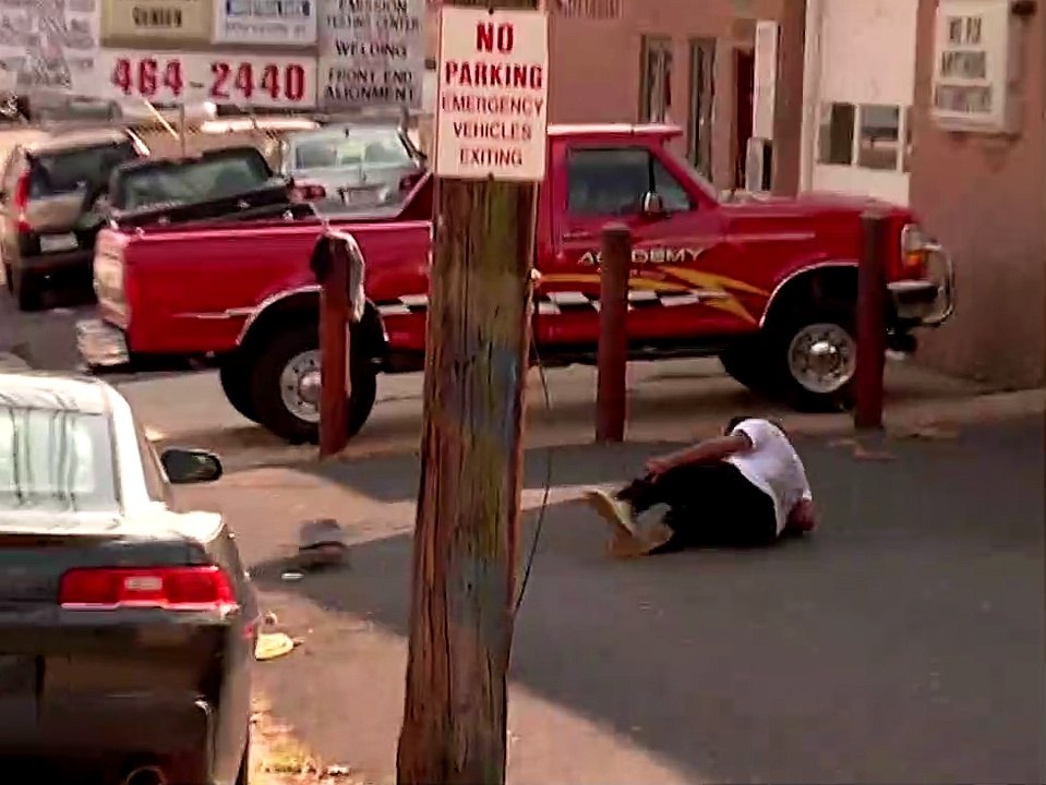 Skateboarder kickflips gap and lands awkwardly on his leg