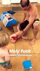 Guy picks up baby in VTech carton and baby falls out
