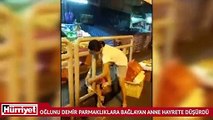 Tayland'da küçük oğlunu plastik kordonla yoldaki demir parmaklıklara bağlayan anne görenleri hayrete düşürdü