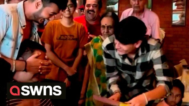 Heartwarming moment a dad is moved to tears as his son surprises him on his 50th birthday after spending a year apart
