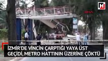 İzmir'de vincin çarptığı yaya üst geçidi, metro hattının üzerine çöktü