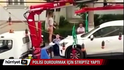 Polisi durdurmak için striptiz yaptı
