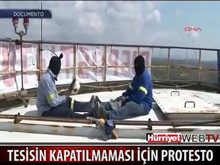 İŞÇİLER TESİSİN KAPATILMAMASI İÇİN FABRİKA KULESİNE ÇIKTI