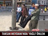 POLİS TAKSİM MEYDANI'NDAKİ DİREKLERİ YAĞLADI