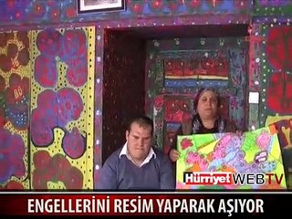 ENGELLERİNİ RESİM YAPARAK AŞIYOR